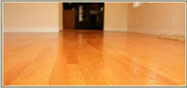 Wood floor with light reflecting across the surface