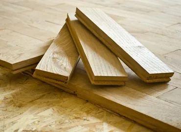 Unfinished wood planks ready for installation