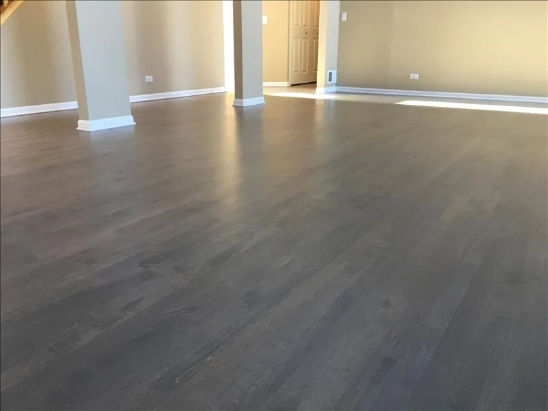 A darker floor finish in a bright room