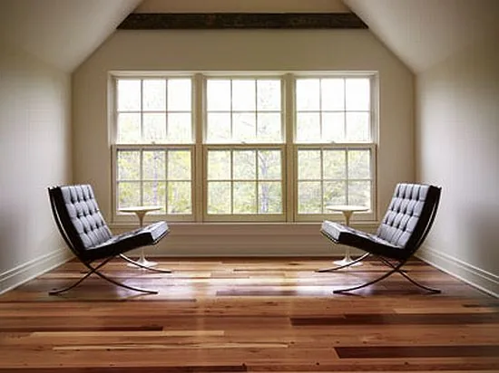 Hardwood floor in a bright window alcove