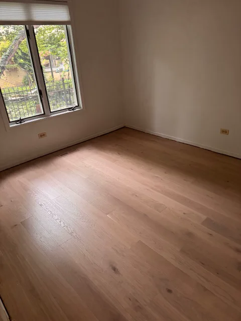Light oak hardwood flooring in a bedroom