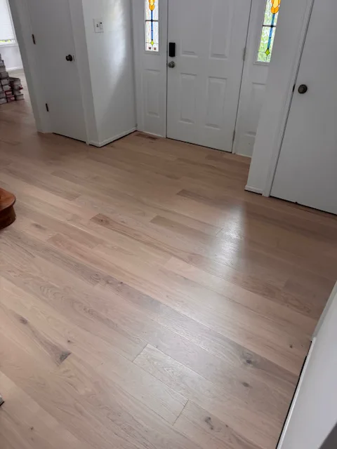 Light oak flooring in an entry hall