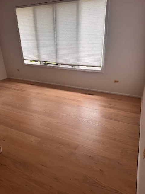 Light oak flooring in a bright room