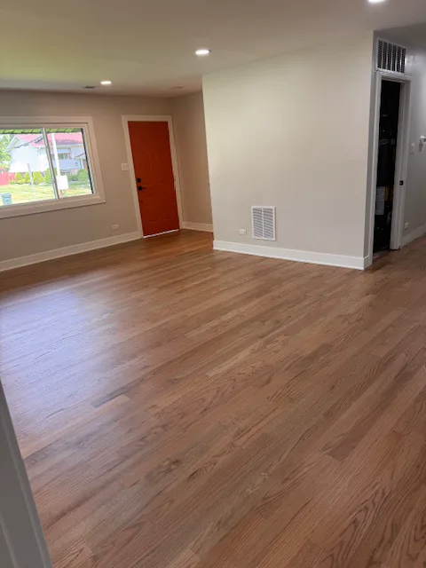 Stained oak floor in an open living room