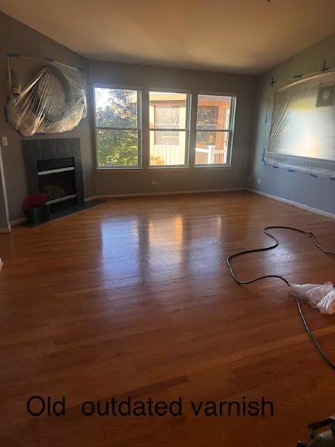 Before: worn, outdated finish on an oak floor in Round Lake, IL