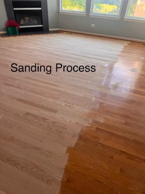 During sanding: the old finish removed down to bare oak